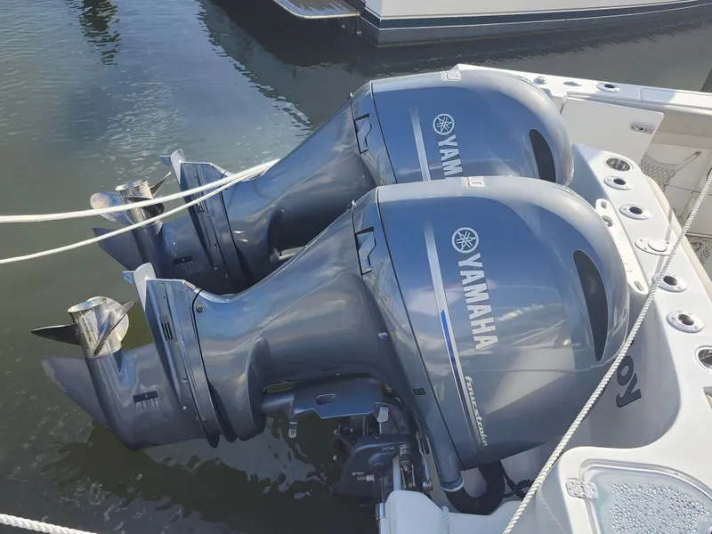 Slide: The Image of Twin Yamaha outboard engines on a 2018 Sailfish 270 CC boat. - 25