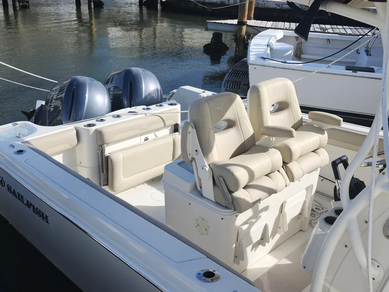 Slide: The Image of 2018 Sailfish 270 CC boat interior with dual engines and comfortable seating. - 7