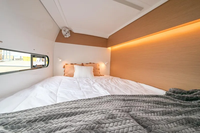 Slide: The Image of Cozy bedroom interior in 2025 Excess 11, featuring modern lighting and comfortable bedding. - 25