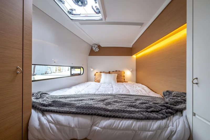 Slide: The Image of Luxurious cabin interior of 2025 Excess 11 yacht with cozy bedding and ambient lighting. - 26