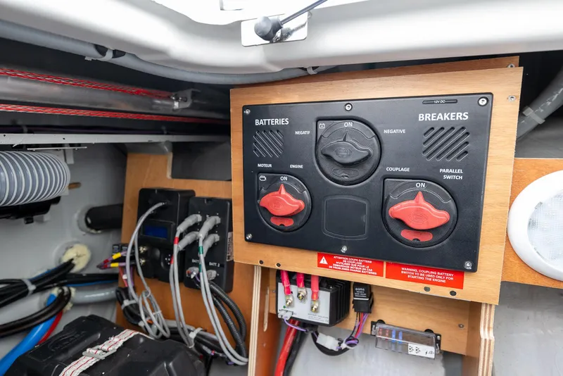 Slide: The Image of Electrical panel in 2025 Excess 11 boat, featuring battery and breaker controls. - 28