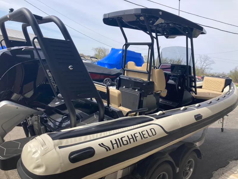 Slide: The Image of 2025 Highfield Sport 700 boat with Mercury engine in showroom. - 2