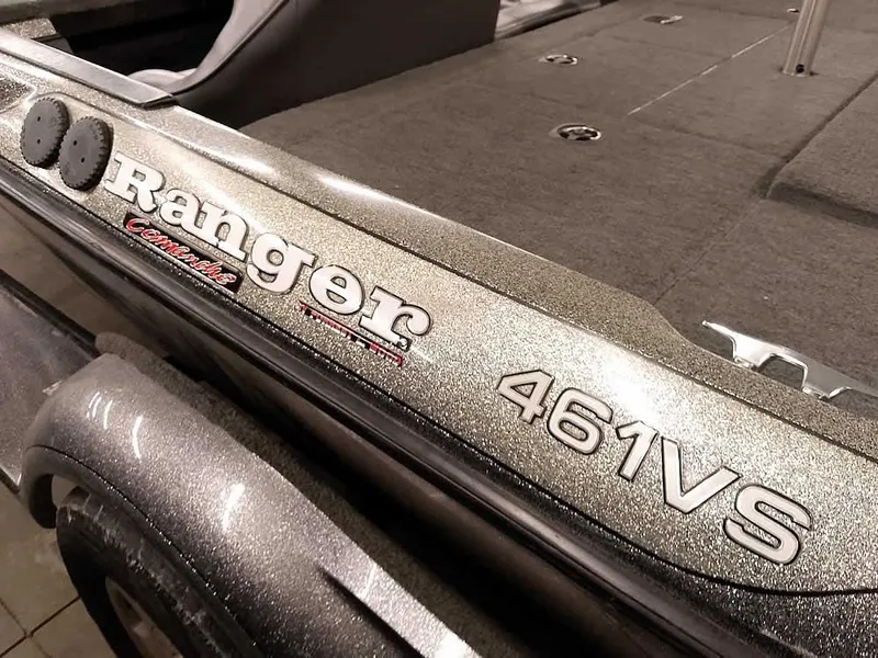 Slide: The Image of 1999 Ranger 461VS Comanche boat deck with logo and model details. - 10
