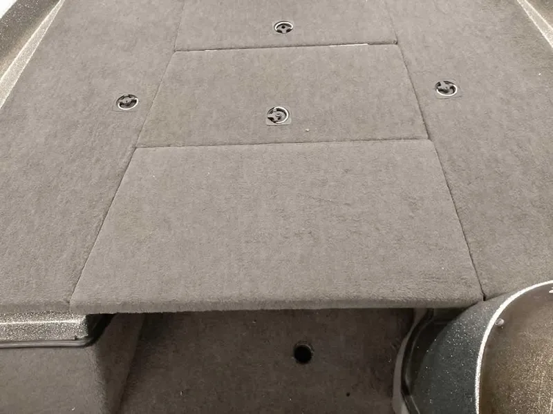 Slide: The Image of 1999 Ranger 461VS Comanche boat deck with carpeted storage compartments. - 14