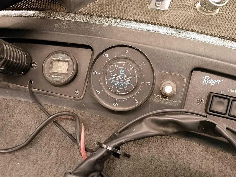 Slide: The Image of Dashboard of a 1999 Ranger 461VS Comanche with Lowrance instruments and controls. - 21