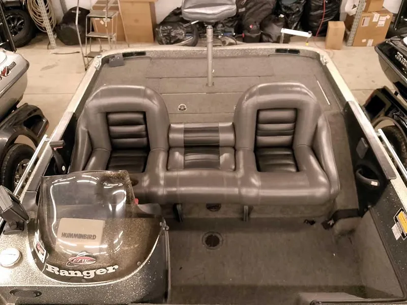 Slide: The Image of 1999 Ranger 461VS Comanche boat interior with dual leather seats and steering console. - 22