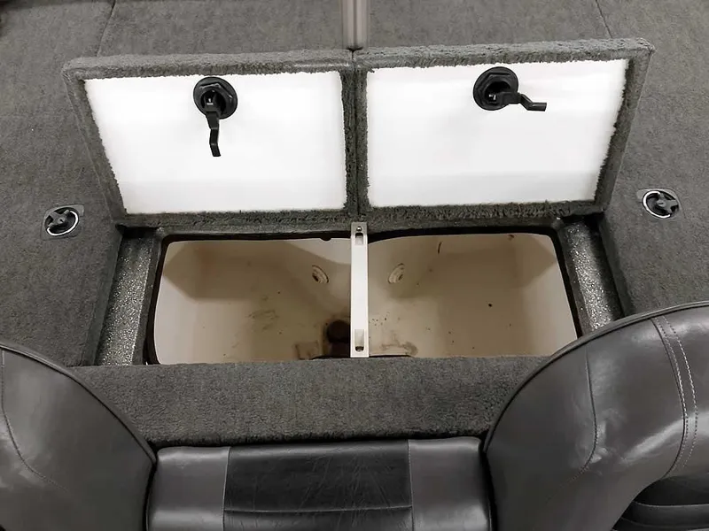 Slide: The Image of 1999 Ranger 461VS Comanche boat storage compartment with open lids and seating. - 28
