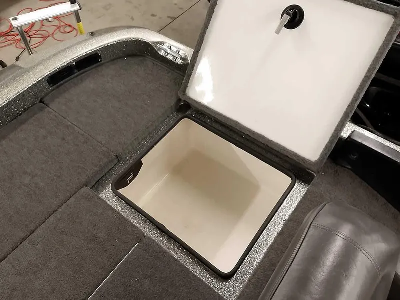 Slide: The Image of 1999 Ranger 461VS Comanche boat storage compartment with open lid, showcasing interior space. - 29