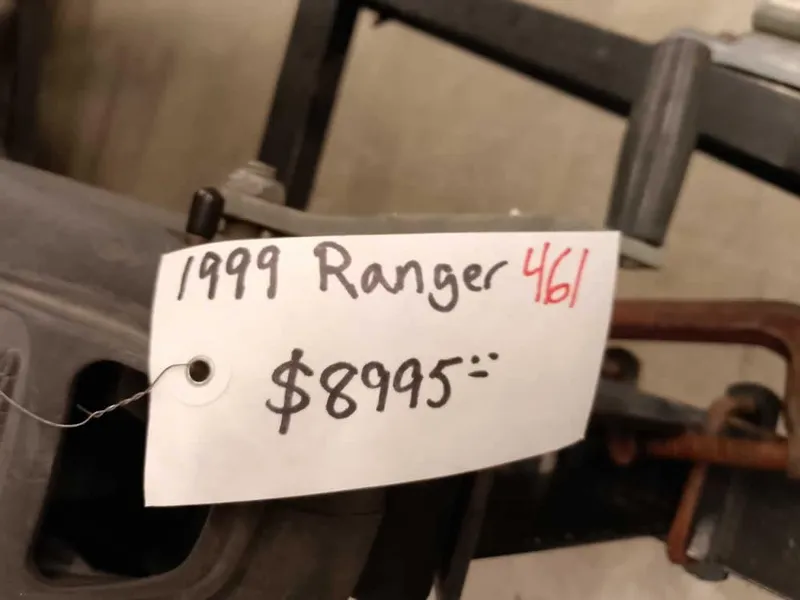 Slide: The Image of 1999 Ranger 461VS Comanche price tag, $8995, displayed on equipment. - 3