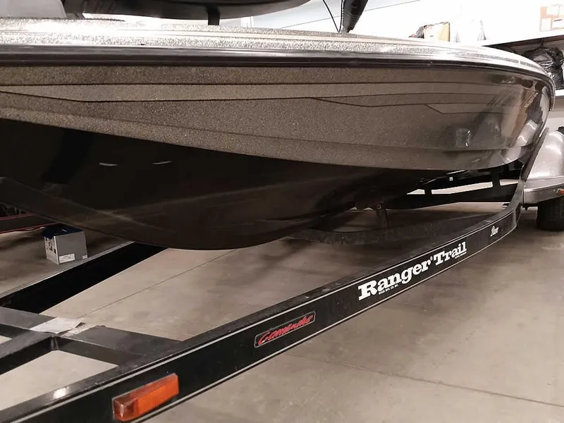 Slide: The Image of 1999 Ranger 461VS Comanche boat on Ranger Trail trailer in a garage. - 6