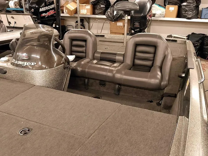 Slide: The Image of 1999 Ranger 461VS Comanche boat interior with dual seats and steering console. - 9