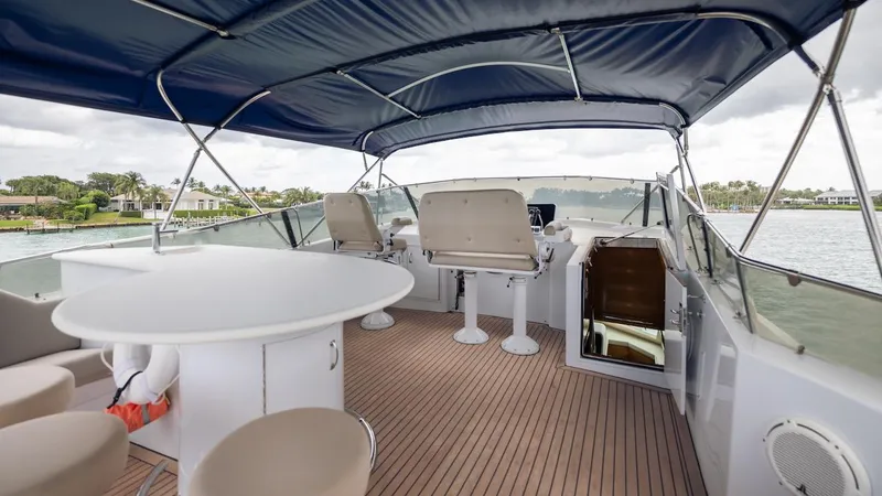 Slide: The Image of 1998 Hatteras 74 Sport Deck Motor Yacht with spacious upper deck and seating area. - 26