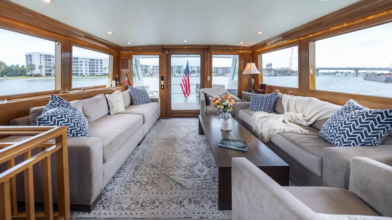 Slide: The Image of Luxurious interior of 1998 Hatteras 74 Sport Deck Motor Yacht with elegant seating and waterfront views. - 37