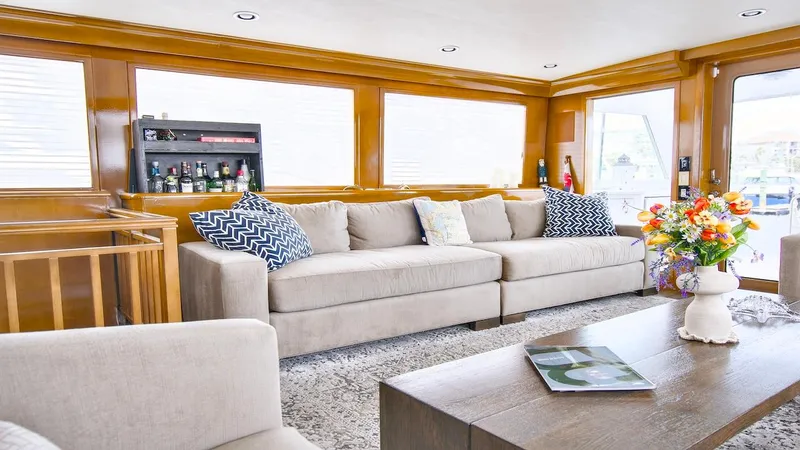 Slide: The Image of Luxurious interior of 1998 Hatteras 74 Sport Deck Motor Yacht with elegant seating and decor. - 38