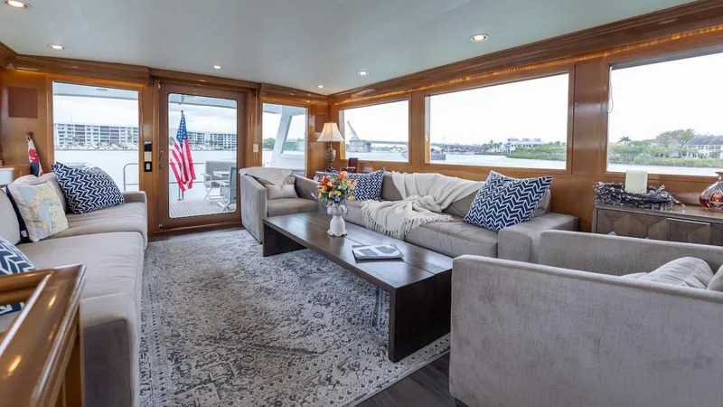 Slide: The Image of Luxurious interior of 1998 Hatteras 74 Sport Deck Motor Yacht with elegant seating and decor. - 39