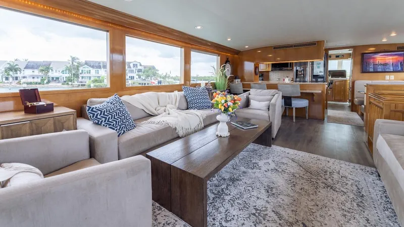 Slide: The Image of Luxurious interior of 1998 Hatteras 74 Sport Deck Motor Yacht with elegant seating and decor. - 41