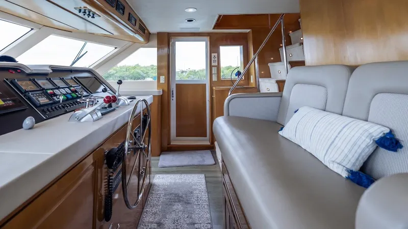 Slide: The Image of Interior of 1998 Hatteras 74 Sport Deck Motor Yacht with helm and seating area. - 45