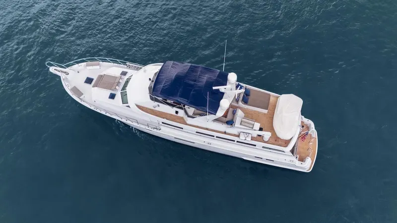 Slide: The Image of 1998 Hatteras 74 Sport Deck Motor Yacht on open water, aerial view. - 5