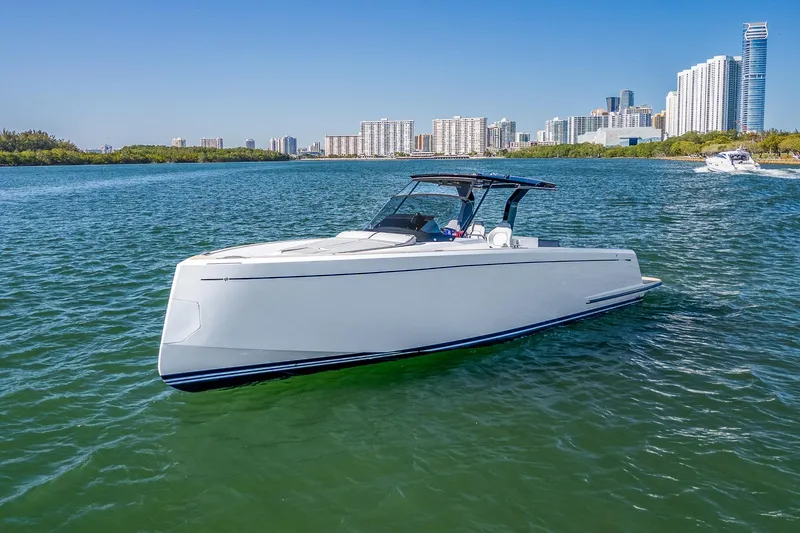 The Image of 2023 Pardo Yachts P38 cruising on a sunny day near a city skyline. - 1