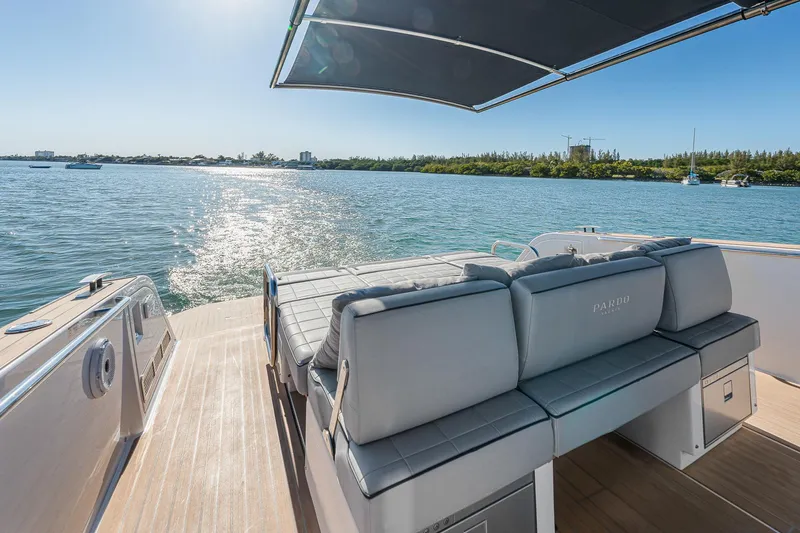 Slide: The Image of 2023 Pardo Yachts P38 luxury deck with seating, overlooking serene waters. - 31