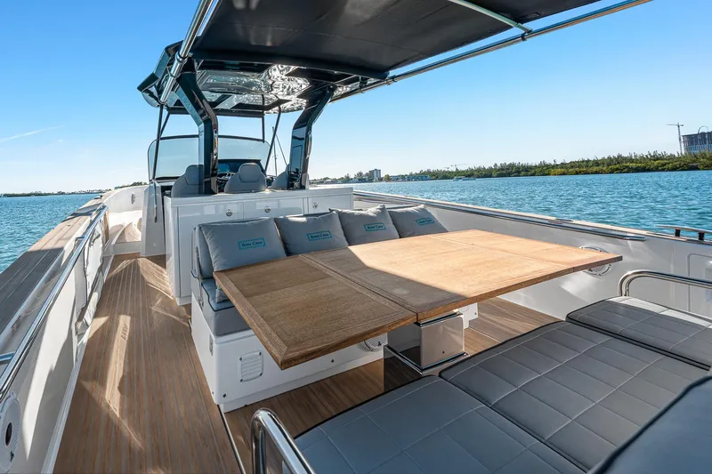 Slide: The Image of 2023 Pardo Yachts P38 with sleek deck and seating, cruising on a sunny day. - 36