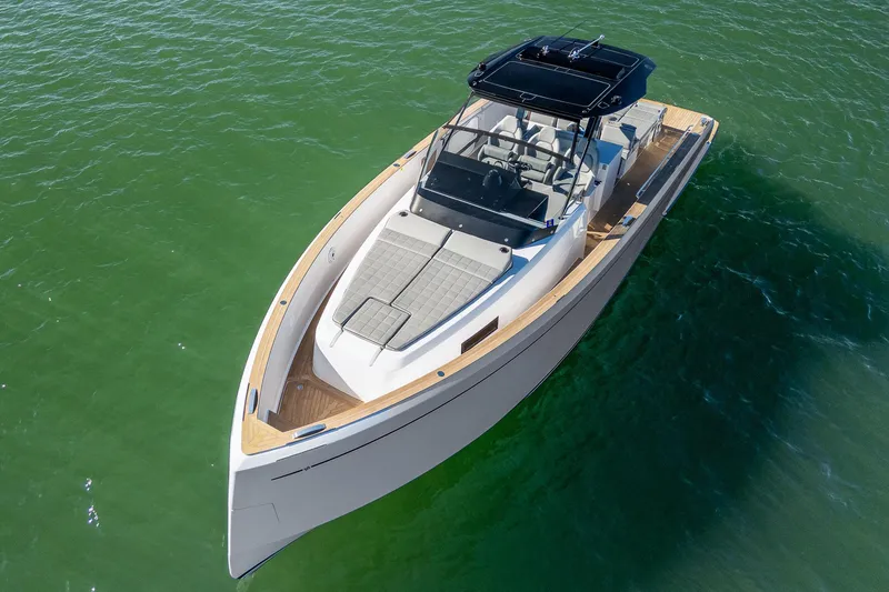 Slide: The Image of 2023 Pardo Yachts P38 luxury boat on calm green water. - 11