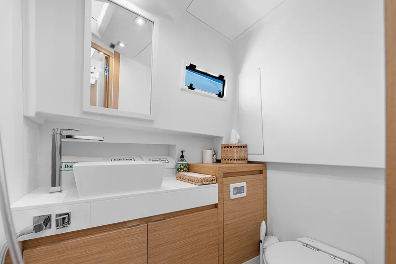 Slide: The Image of Modern bathroom interior on 2023 Pardo Yachts P38, featuring sleek design and wooden cabinetry. - 22