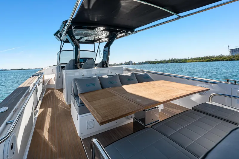 Slide: The Image of 2023 Pardo Yachts P38 luxury yacht interior with seating and table on open water. - 37