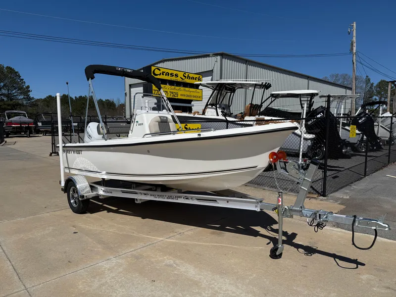 Slide: The Image of 2025 Key West 1720 Center Console boat on trailer, parked outdoors. - 1