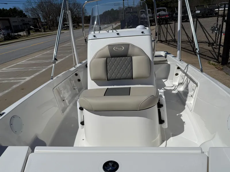 Slide: The Image of 2025 Key West 1720 Center Console boat interior with cushioned seating and steering console. - 10