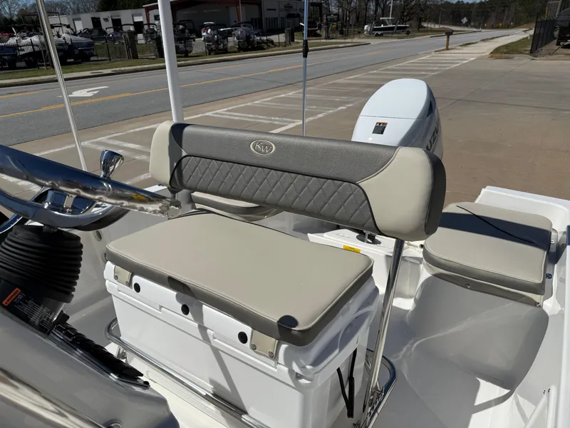 Slide: The Image of 2025 Key West 1720 Center Console boat interior with cushioned seating and console. - 14
