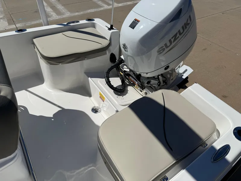 Slide: The Image of 2025 Key West 1720 Center Console boat with Suzuki outboard motor and cushioned seating. - 15