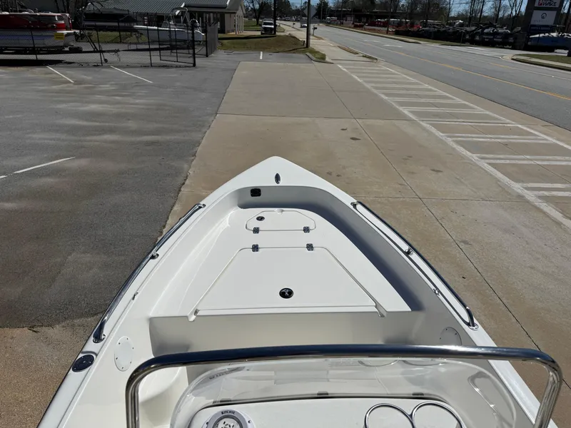 Slide: The Image of 2025 Key West 1720 Center Console boat parked on a concrete lot. - 17