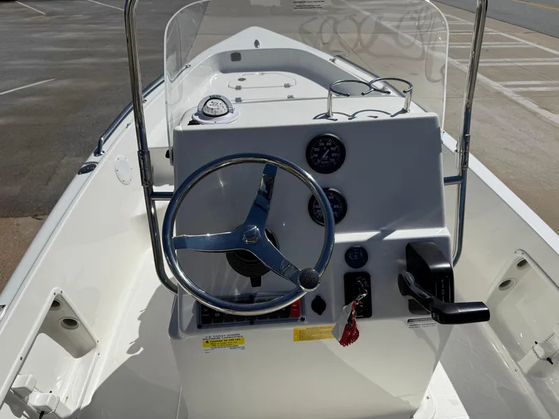 Slide: The Image of 2025 Key West 1720 Center Console boat interior with steering wheel and control panel. - 18
