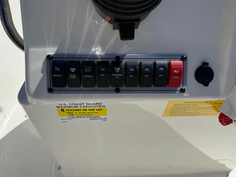Slide: The Image of Control panel of 2025 Key West 1720 Center Console boat with labeled switches. - 22