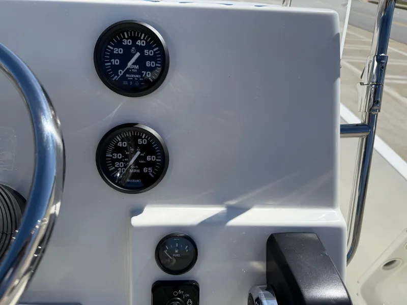 Slide: The Image of 2025 Key West 1720 Center Console dashboard with gauges and controls. - 23