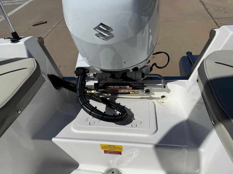 Slide: The Image of 2025 Key West 1720 Center Console boat with Suzuki outboard motor, rear view. - 25