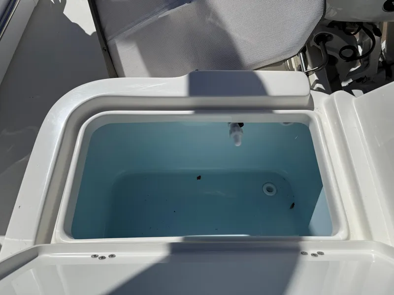 Slide: The Image of Livewell on a 2025 Key West 1720 Center Console boat, open and empty. - 26