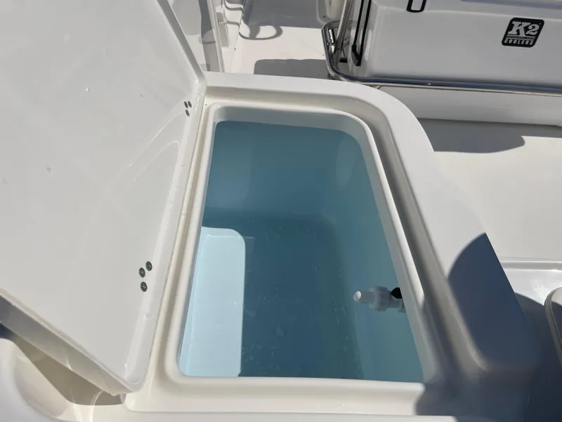 Slide: The Image of 2025 Key West 1720 Center Console livewell with open lid, showcasing interior water storage. - 27