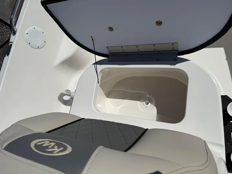 Slide: The Image of 2025 Key West 1720 Center Console boat seat with storage compartment open. - 29