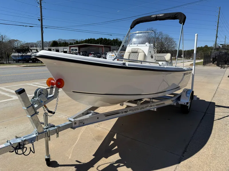 Slide: The Image of 2025 Key West 1720 Center Console boat on trailer, parked outdoors. - 3