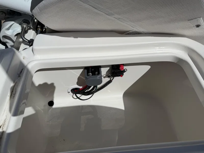 Slide: The Image of Storage compartment in 2025 Key West 1720 Center Console boat, featuring wiring and connectors. - 33