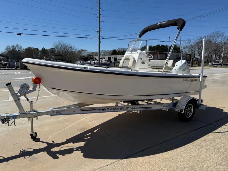 Slide: The Image of 2025 Key West 1720 Center Console boat on trailer, parked outdoors. - 37