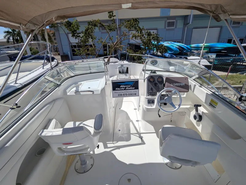 Slide: The Image of 2003 Wellcraft 210 Sportsman boat interior with steering wheel and seating. - 7