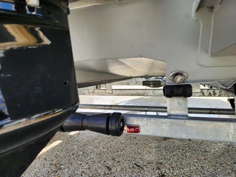 Slide: The Image of 2025 SeaArk 1872 MVT boat trailer close-up, showing undercarriage and hitch details. - 4