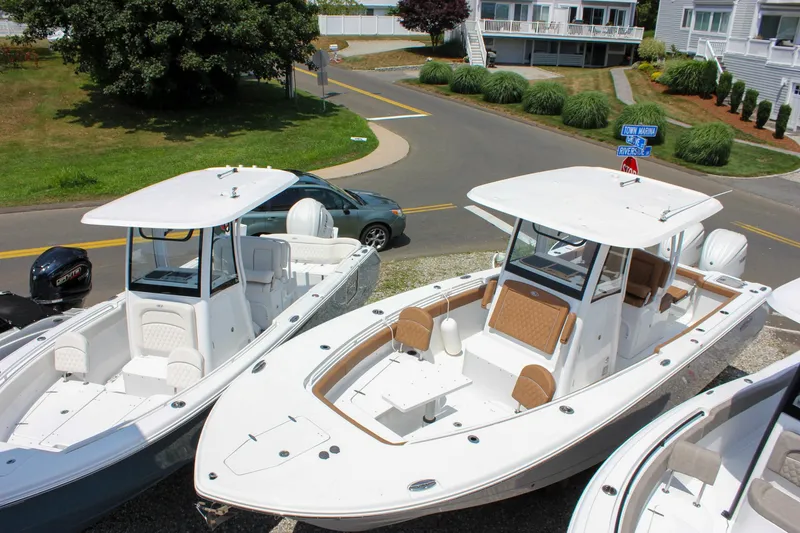 Slide: The Image of 2025 Sea Hunt Gamefish 28 Forward Seating boat displayed outdoors, showcasing sleek design and spacious layout. - 2