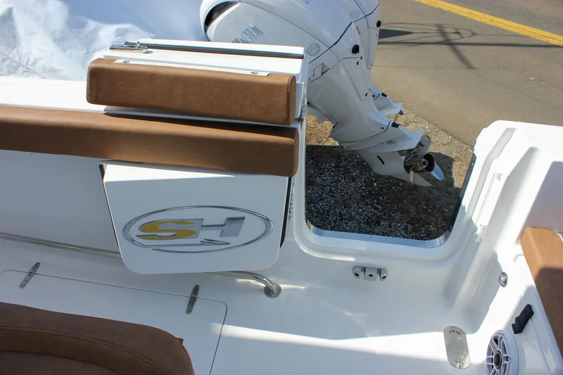 Slide: The Image of 2025 Sea Hunt Gamefish 28 boat with brown seating and motor detail. - 24