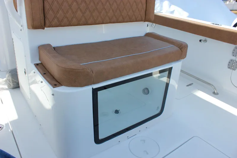 Slide: The Image of 2025 Sea Hunt Gamefish 28 Forward Seating with cushioned seat and storage compartment. - 25