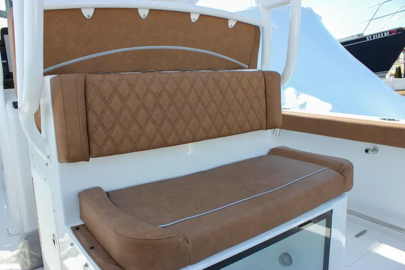 Slide: The Image of 2025 Sea Hunt Gamefish 28 Forward Seating with brown cushioned seats. - 26
