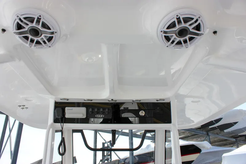 Slide: The Image of 2025 Sea Hunt Gamefish 28 boat interior with speakers and control panel. - 31